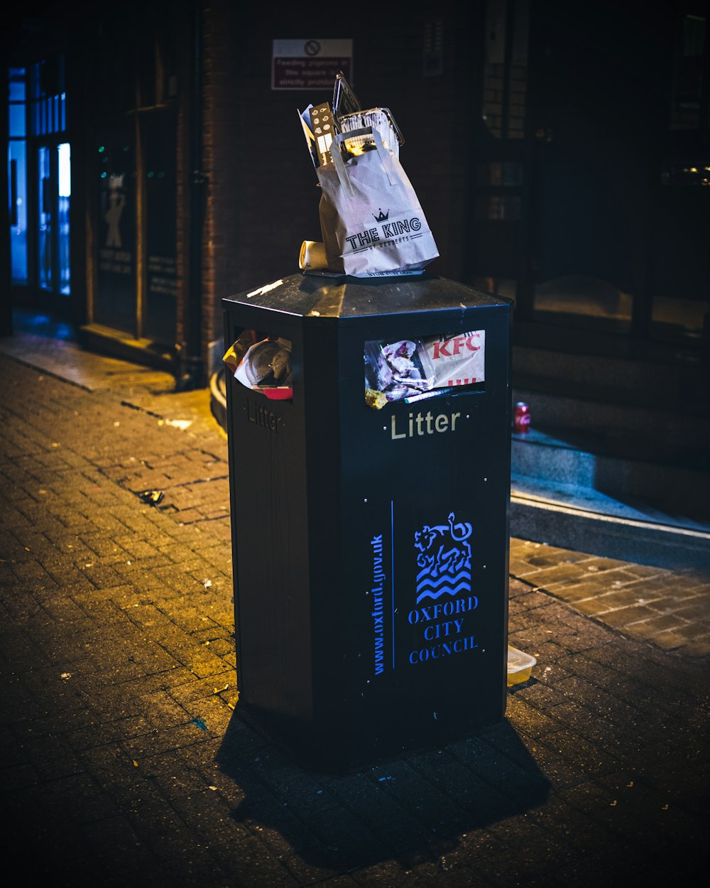 black and white trash bin