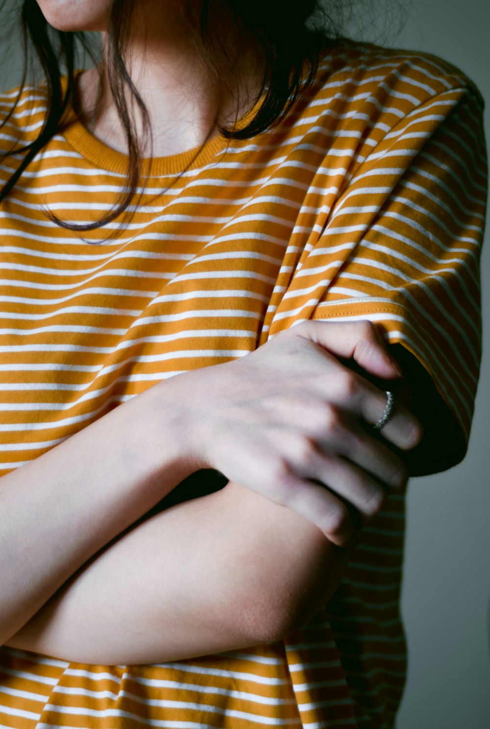 woman in brown and white stripe shirt