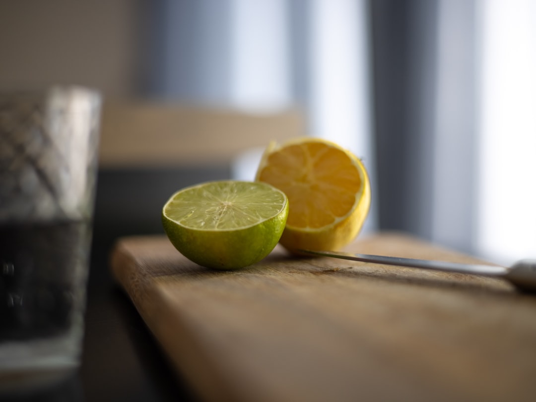 sliced lemon on brown wooden table