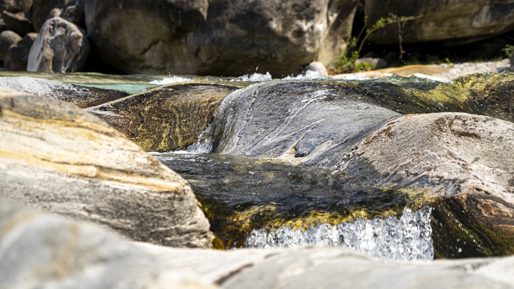 gray rock formation near body of water during daytime