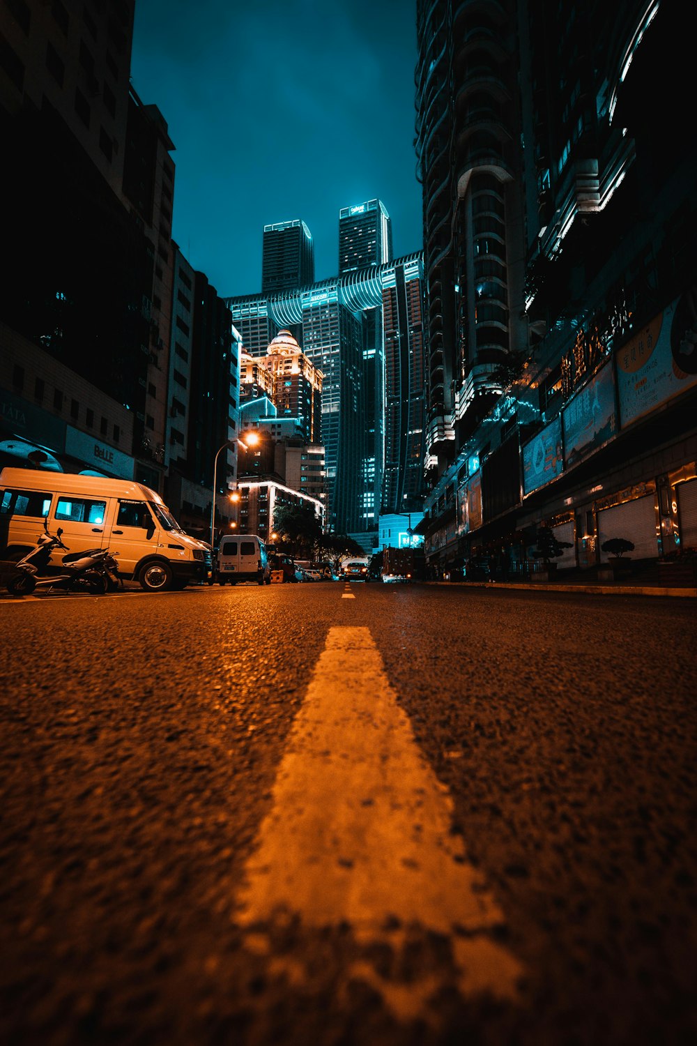 cars on road near buildings during night time