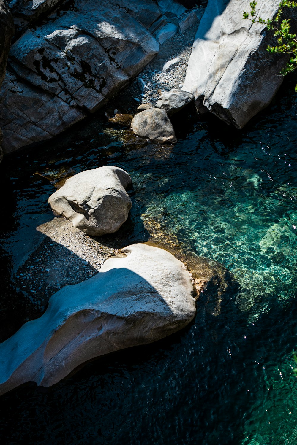 gray and brown rock formation on body of water during daytime