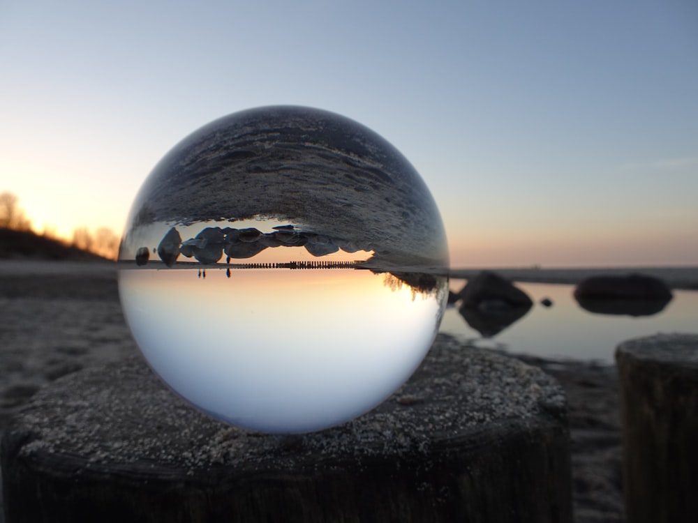 white ball on black rock