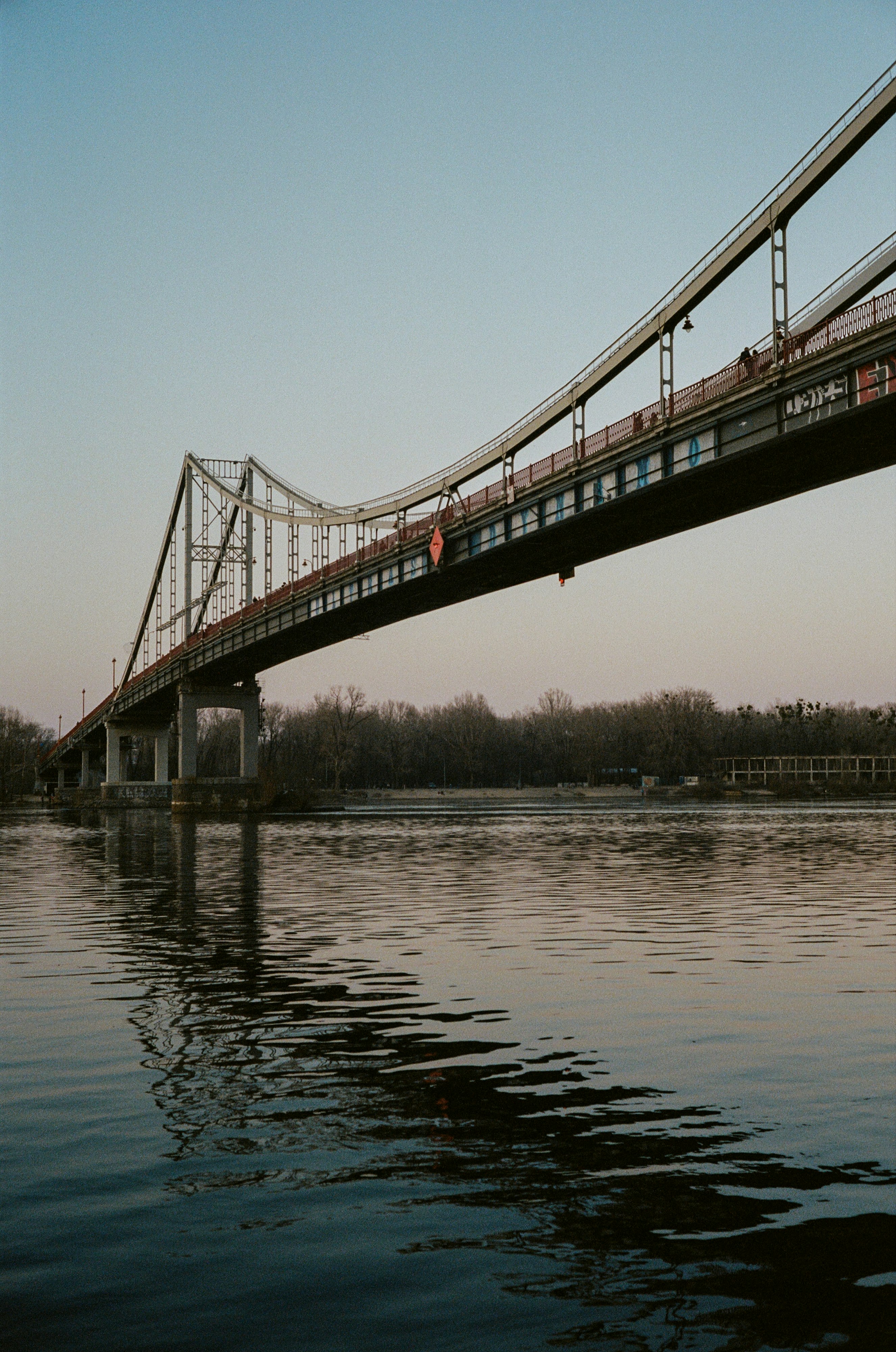 brown bridge over body of water during daytime