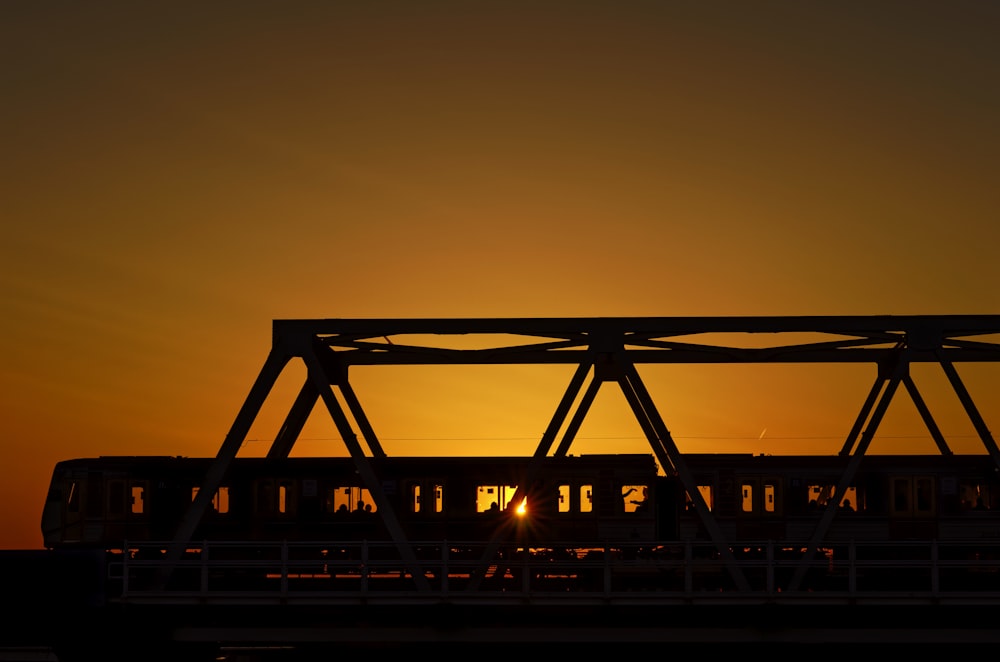 silhouette of bridge during sunset