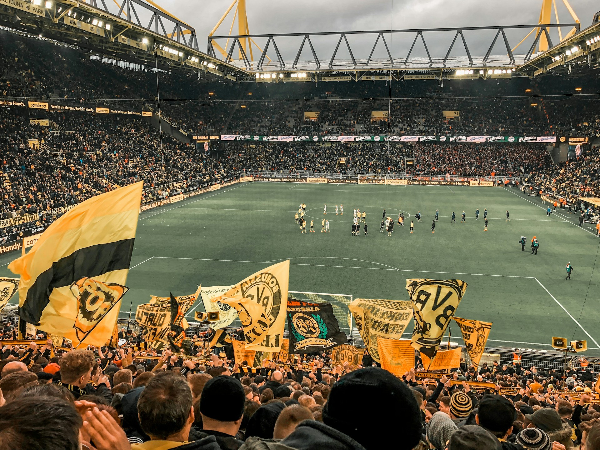 woman wearing yellow long-sleeved dress under white clouds and blue sky during daytime