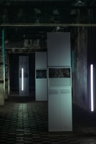 Illuminated factory floor showcasing advanced lighting measurement equipment.