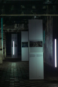 Large-scale visual communication prints in a clean industrial setting.