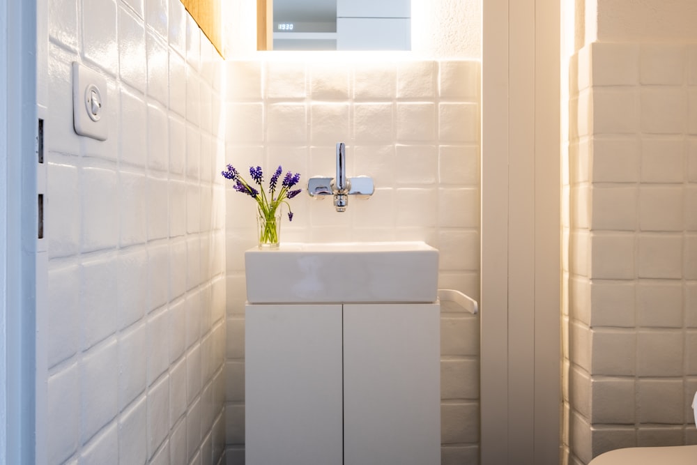 white ceramic sink with faucet