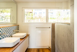 white bathtub near white bathtub