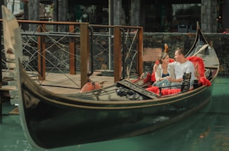 people riding on boat on river during daytime