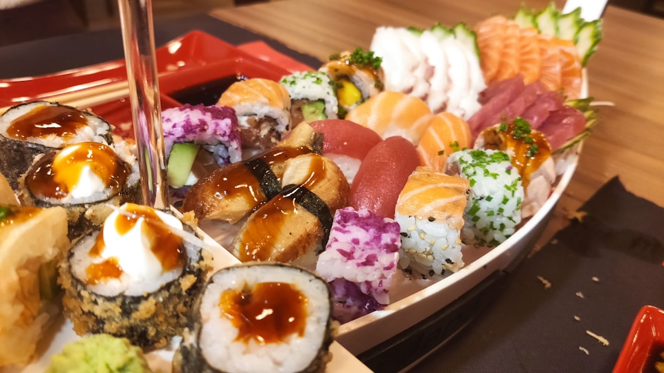 A beautifully arranged platter of various sushi types.