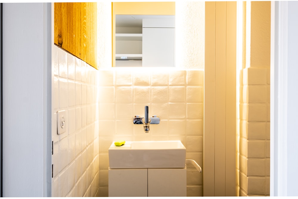 white ceramic sink with faucet