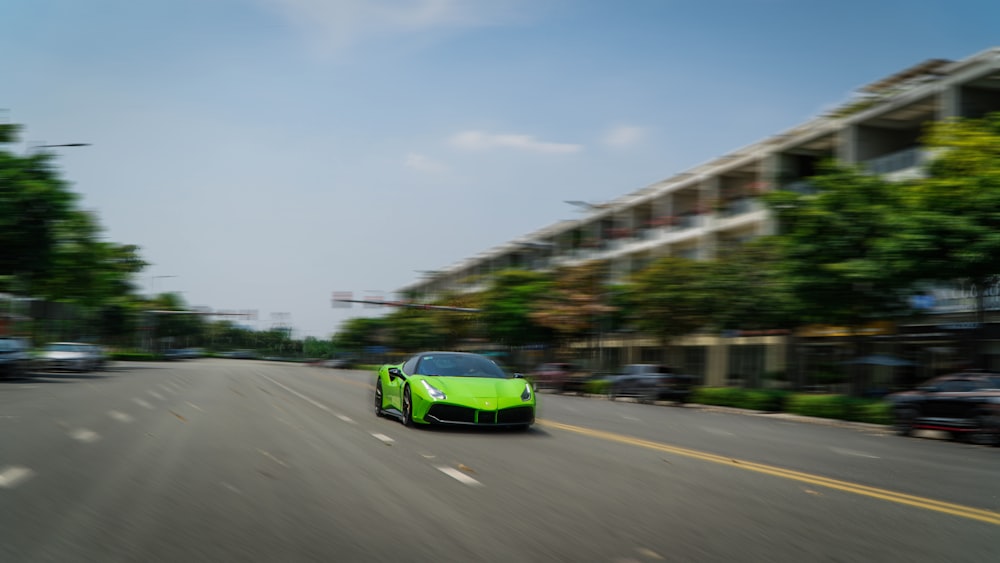 green coupe on road during daytime