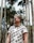 woman in white and blue crew neck t-shirt wearing black sunglasses