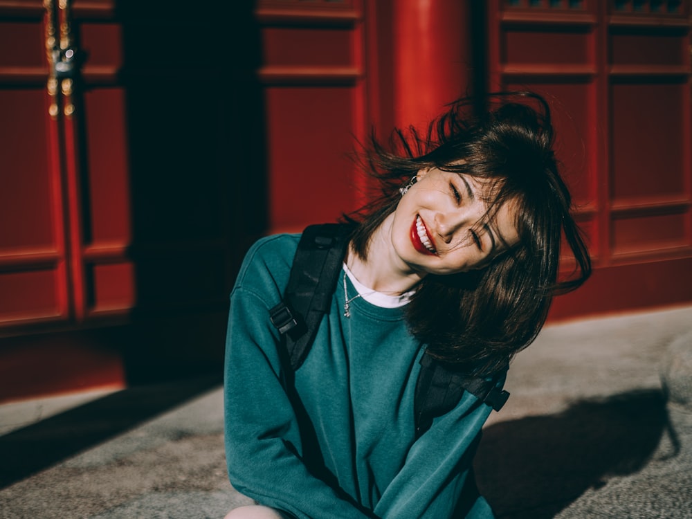 woman in blue sweater smiling
