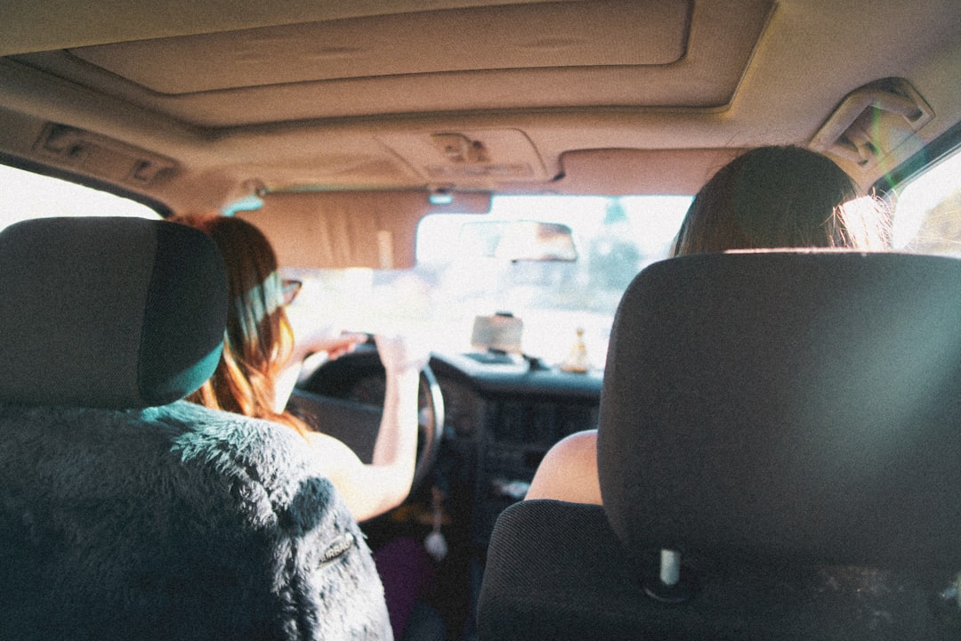 people sitting on car seat, Roadtrip through Europe in car with friends during summer