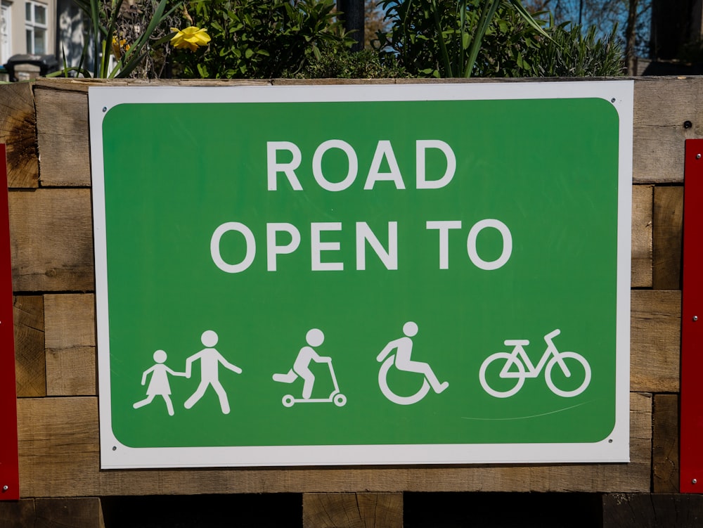 green and white wooden signage