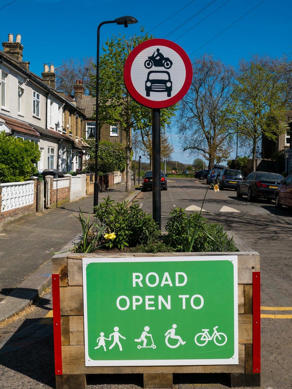 green and white no parking signage