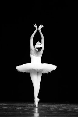 dance photography,how to photograph swan lake japanese ballet dancer; woman in white dress with black sunglasses