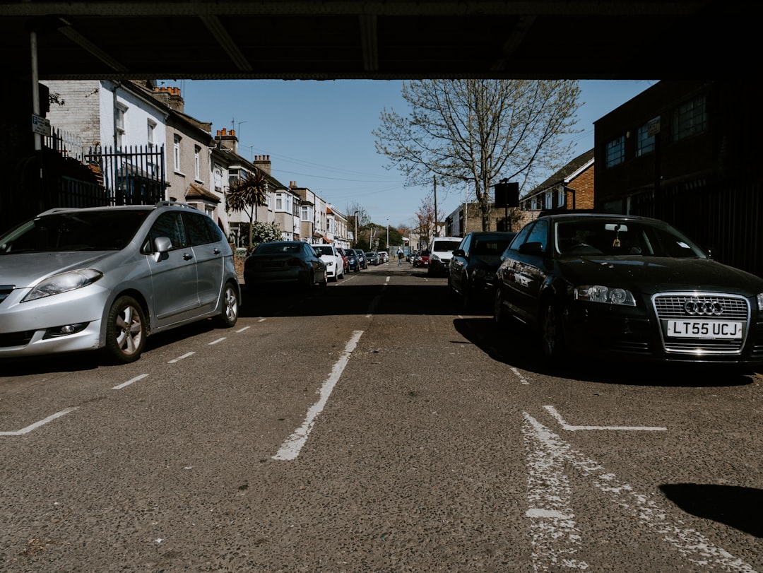 cars parked on parking lot during daytime