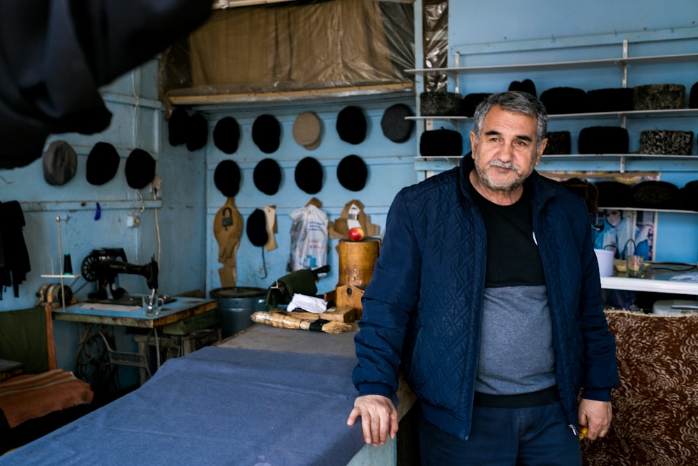 man in blue jacket standing