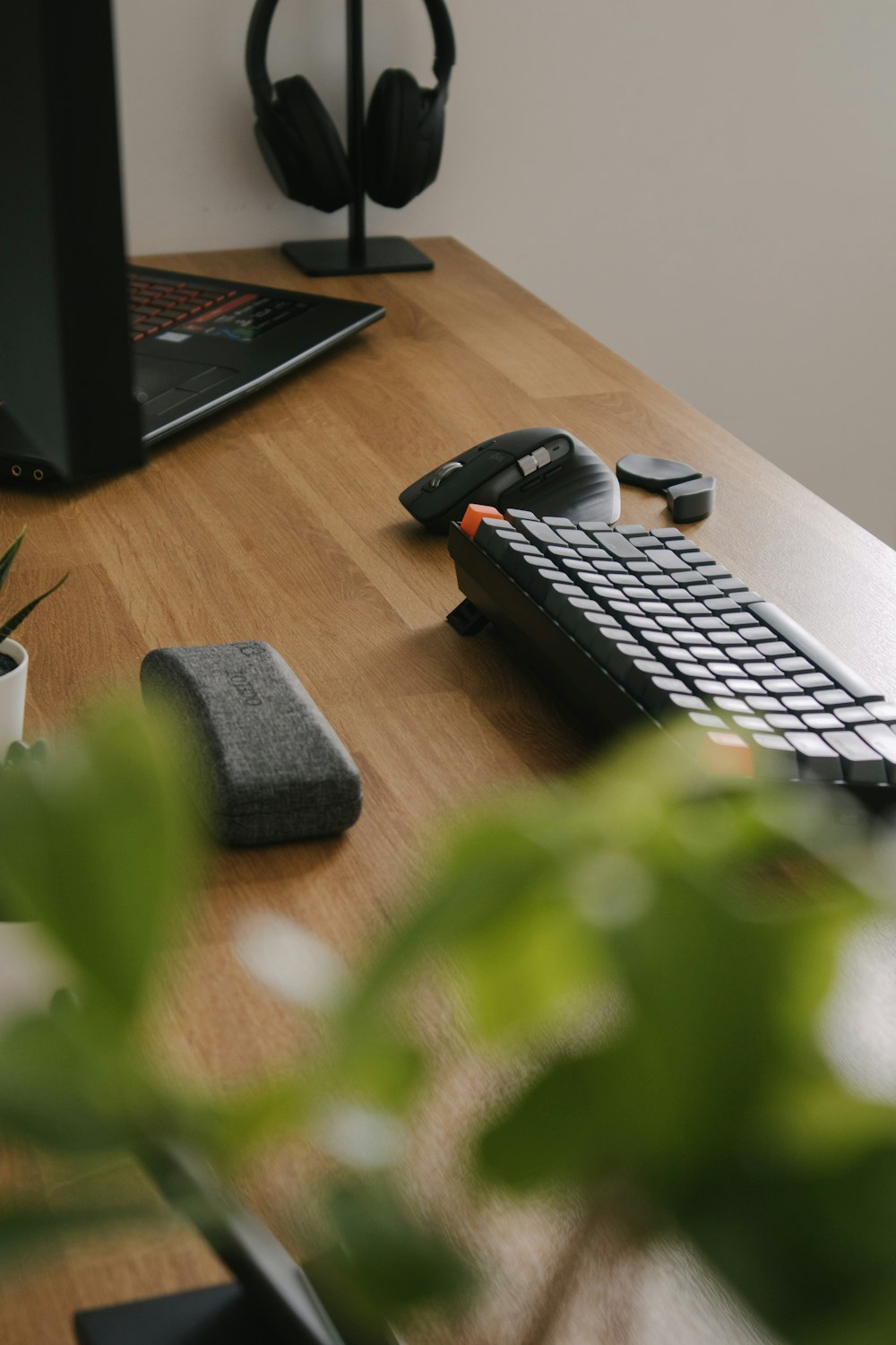 black and gray computer keyboard on brown wooden table