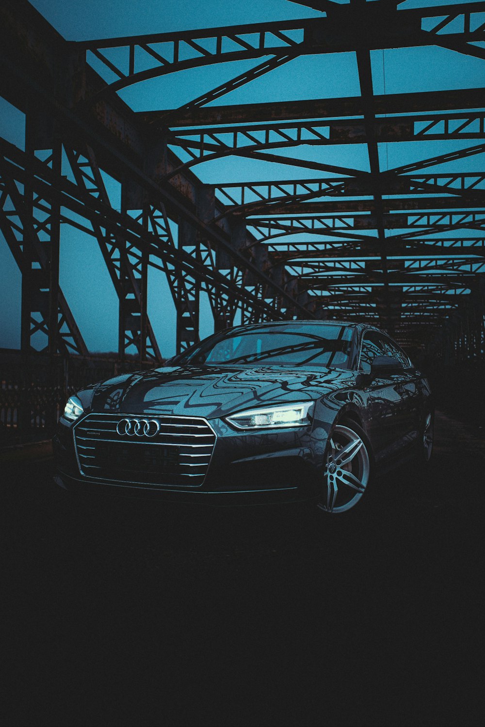 black audi a 4 coupe on bridge