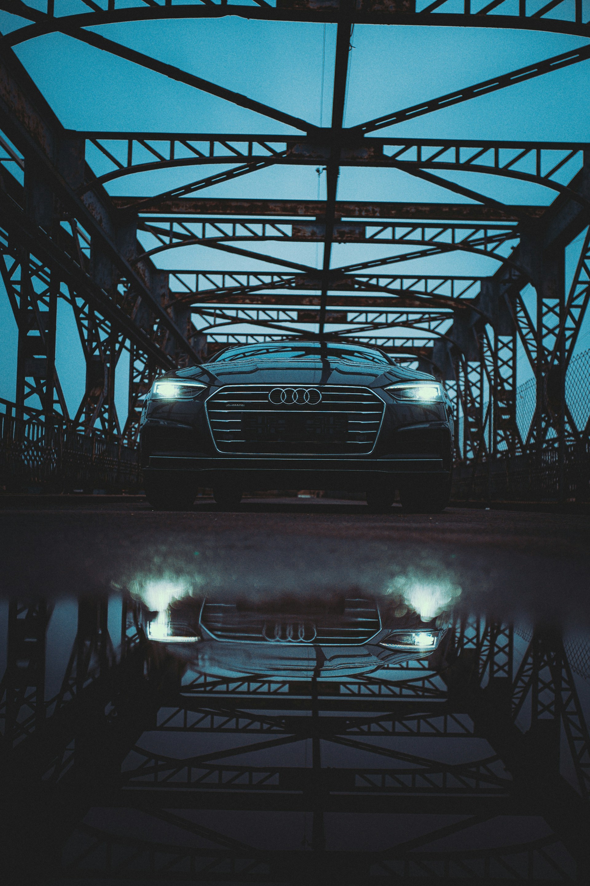 grayscale photo of car in a parking lot