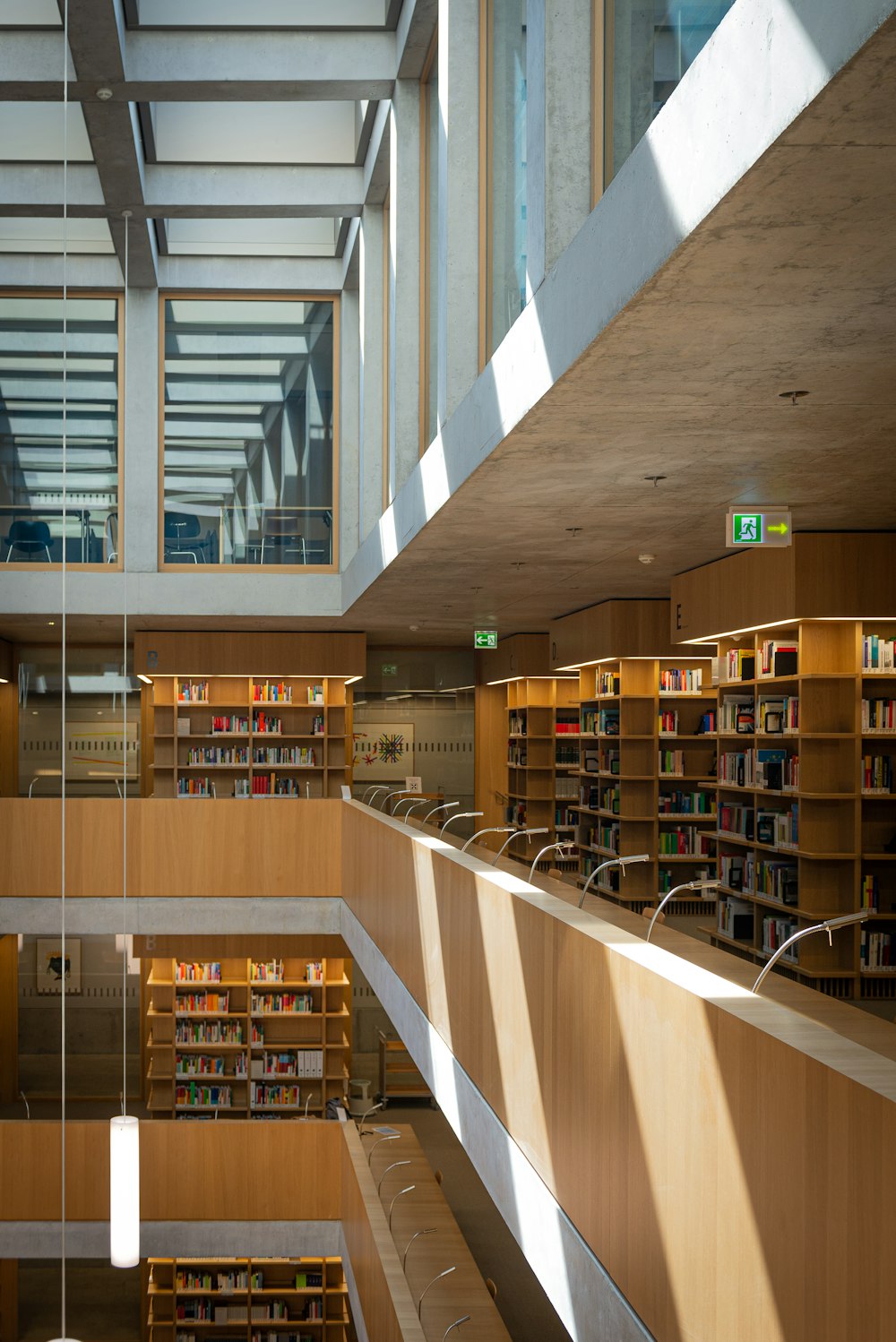 brown wooden book shelves with books