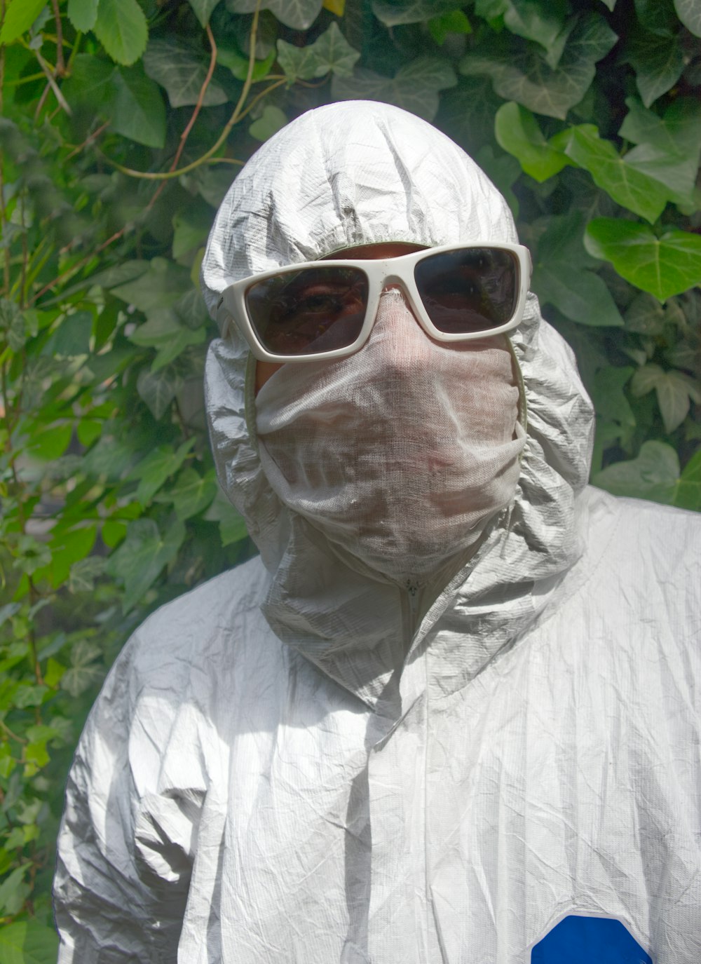 man in white dress shirt wearing white sunglasses