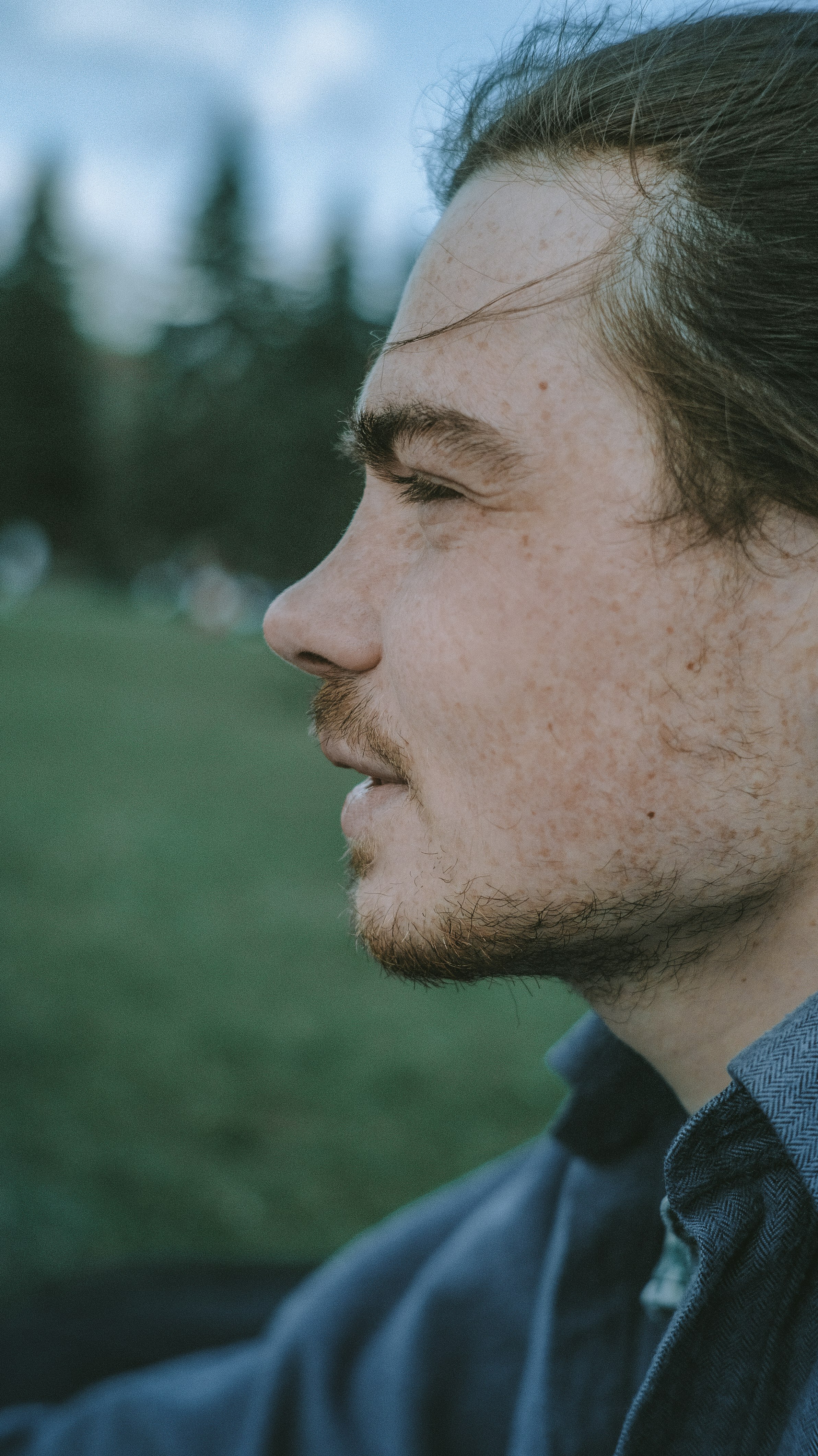 man in blue collared shirt