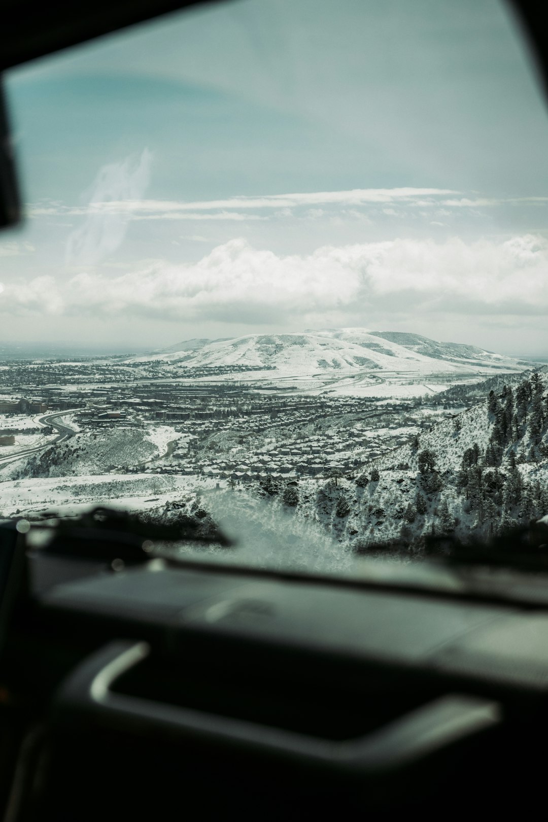 snow covered mountain under cloudy sky during daytime