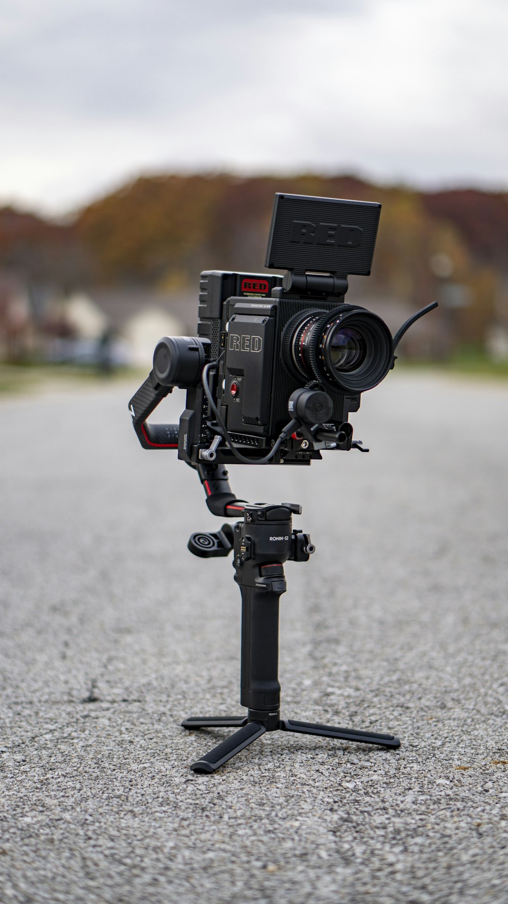 black nikon dslr camera on gray concrete floor