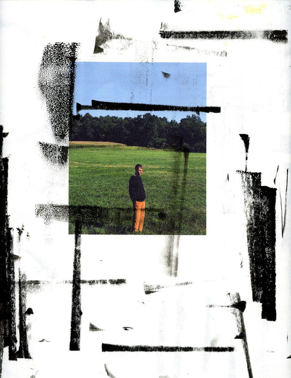 man in red t-shirt standing on green grass field