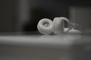 white ceramic mug on white table