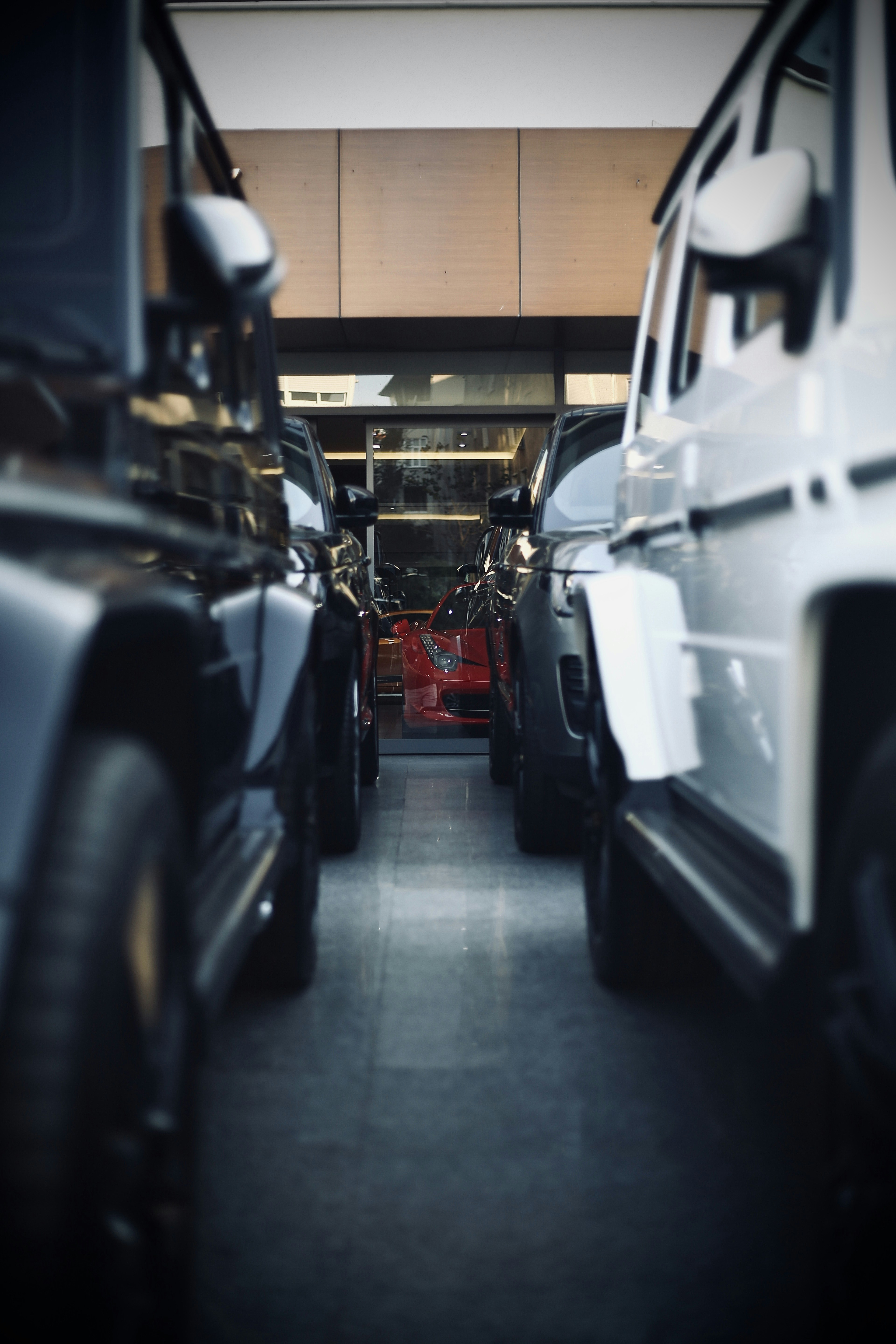 white suv in front of black car