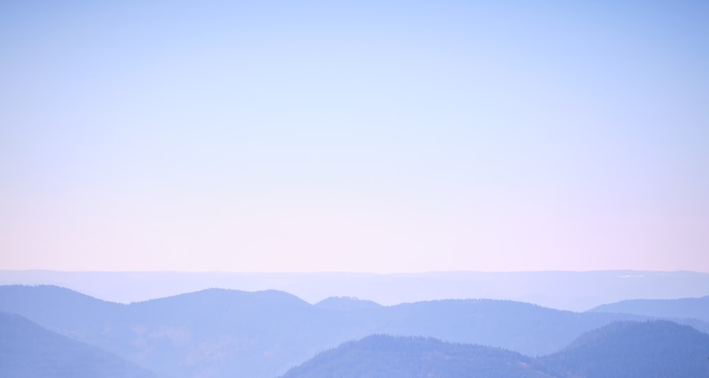 black mountains under white sky during daytime