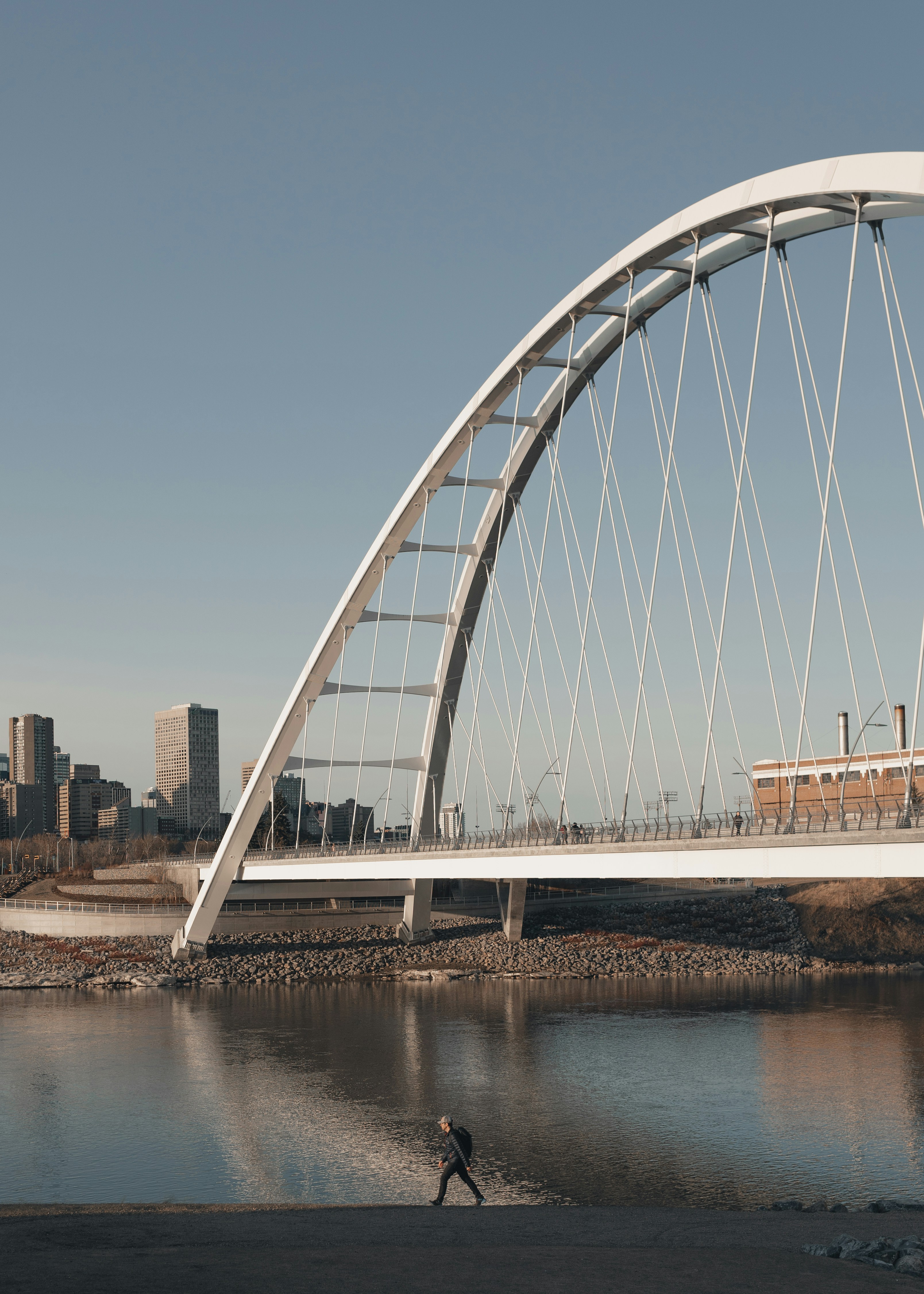 white bridge over body of water during daytime