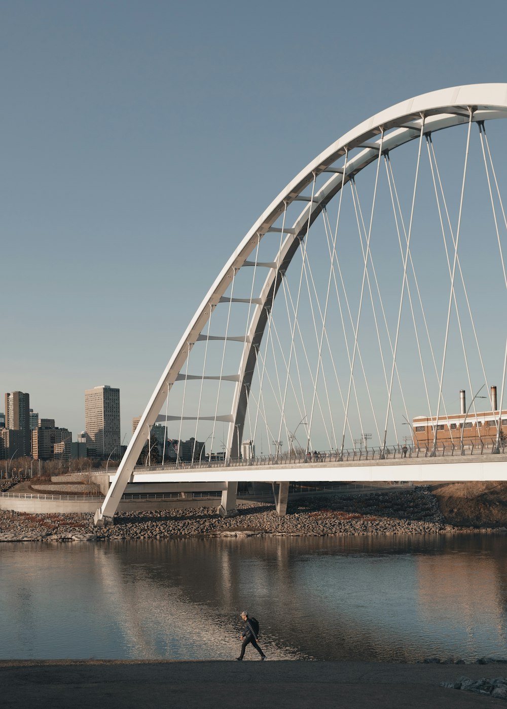 white bridge over body of water during daytime