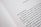 A close-up of an open book page with text in Spanish, discussing feminist topics and gender equality.