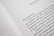 A close-up of an open book page with text in Spanish, discussing feminist topics and gender equality.
