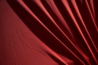 red textile on white textile