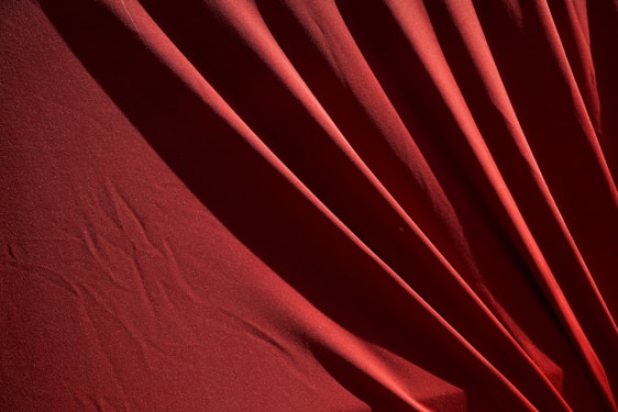 red textile on white textile