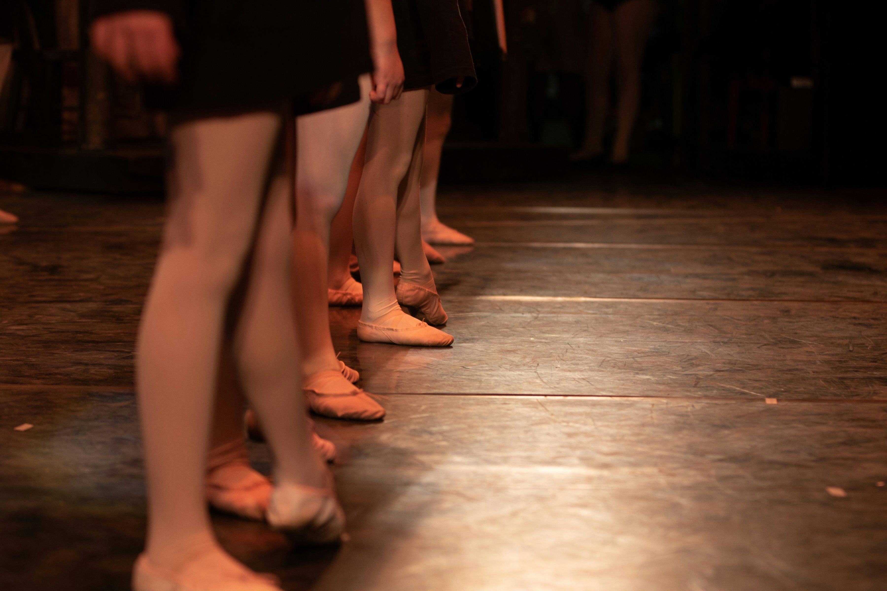 woman in black skirt and brown leather peep toe heeled shoes