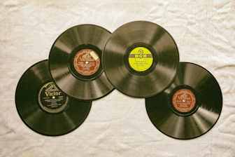 black vinyl record on white textile