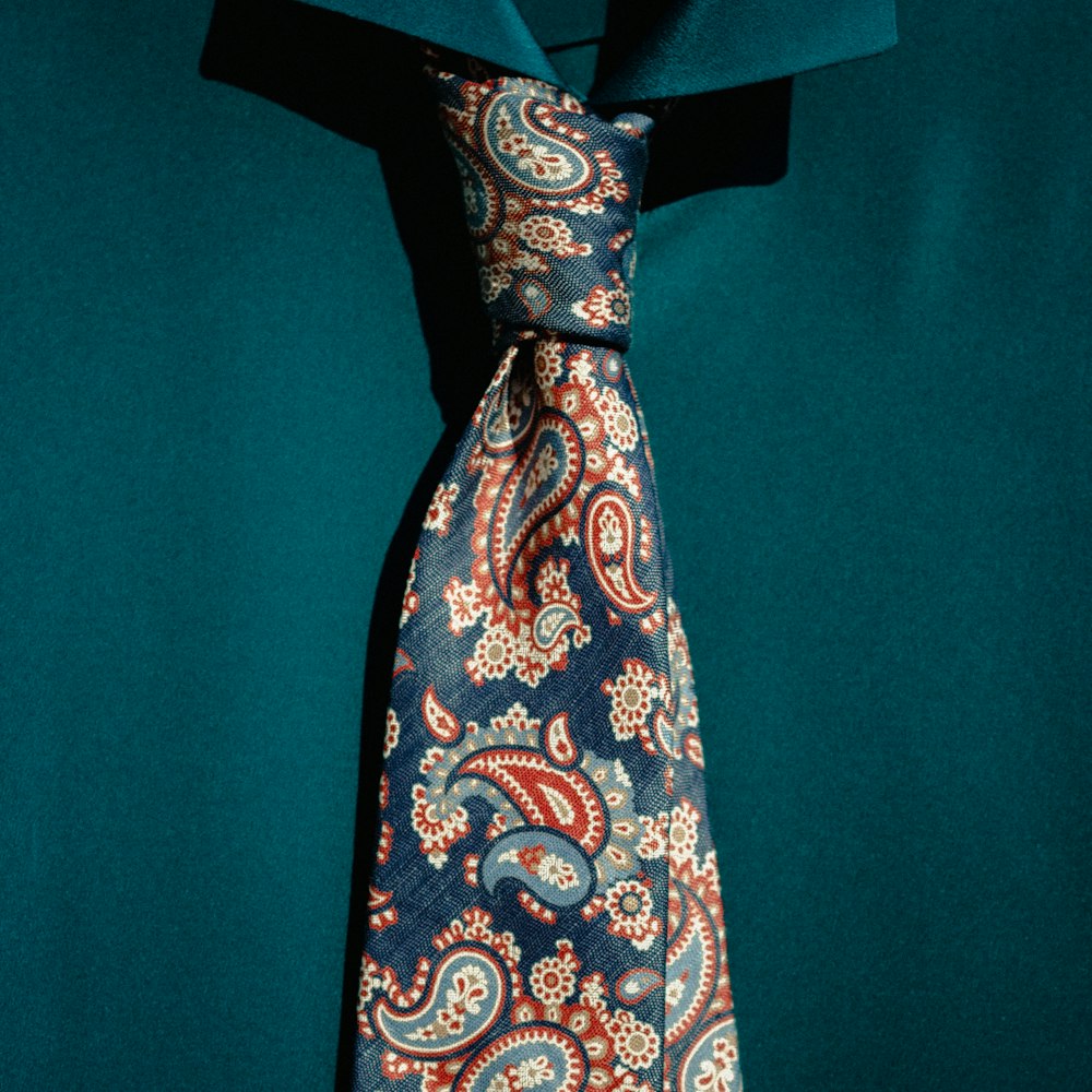 brown and white necktie on blue textile
