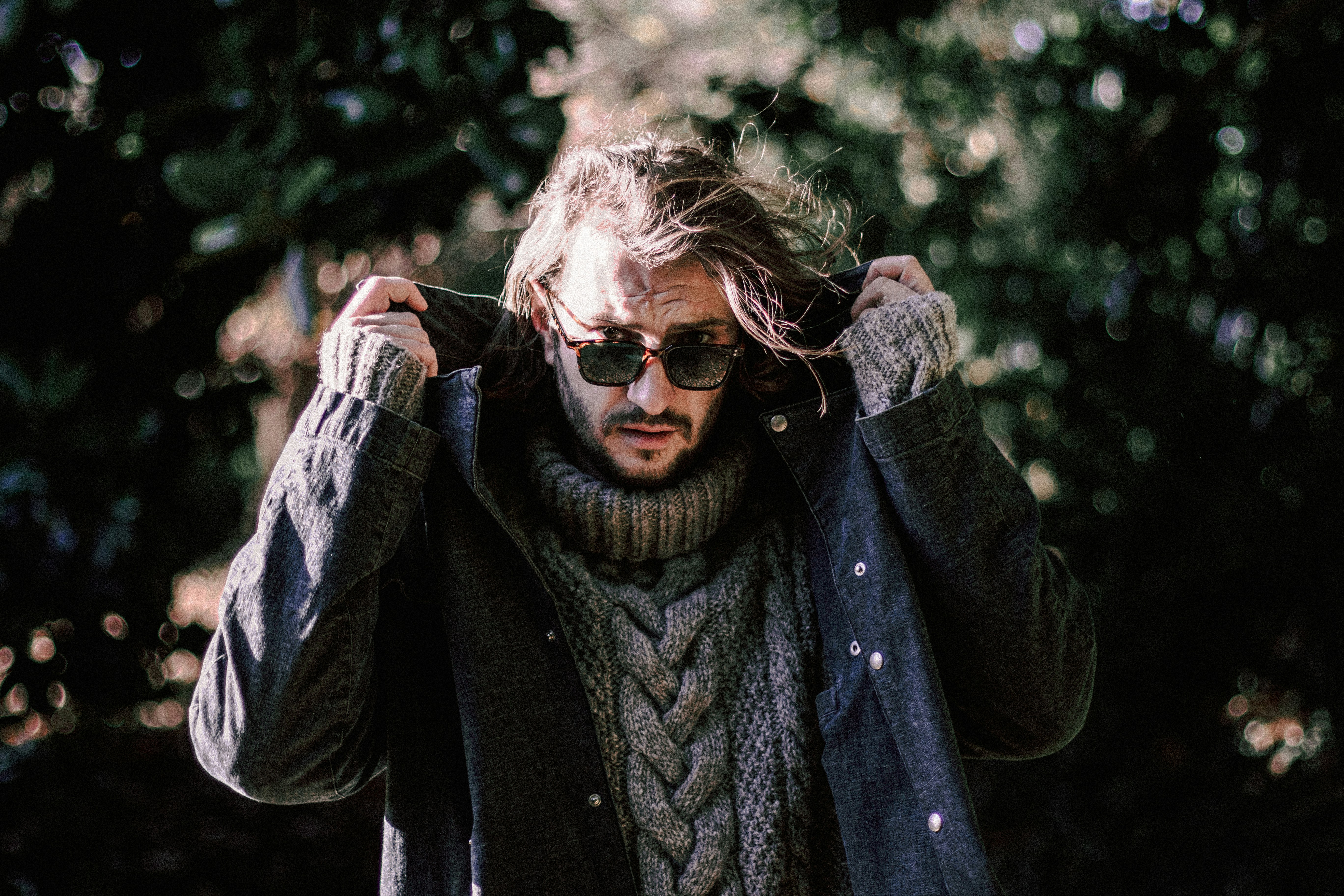 woman in black jacket wearing sunglasses