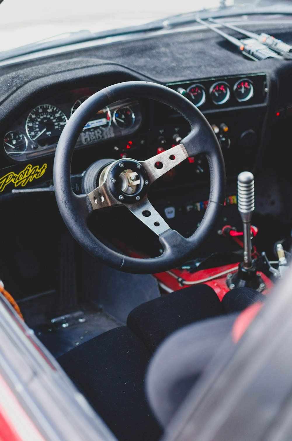 black and silver car steering wheel