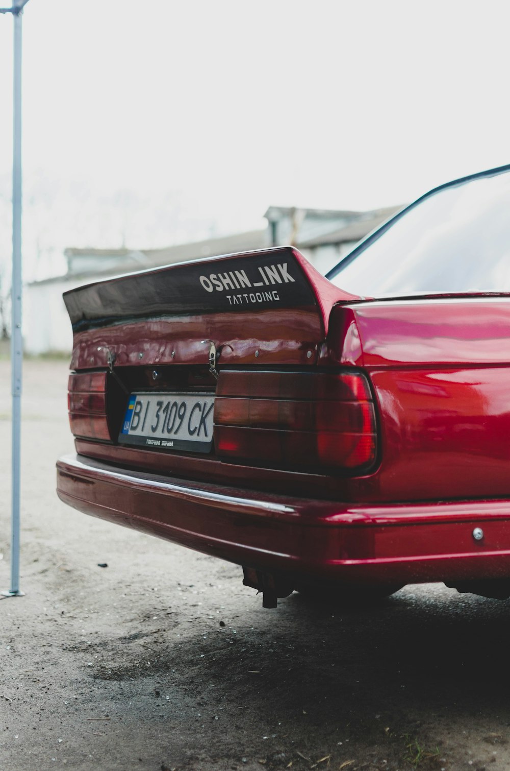 red car on gray concrete floor